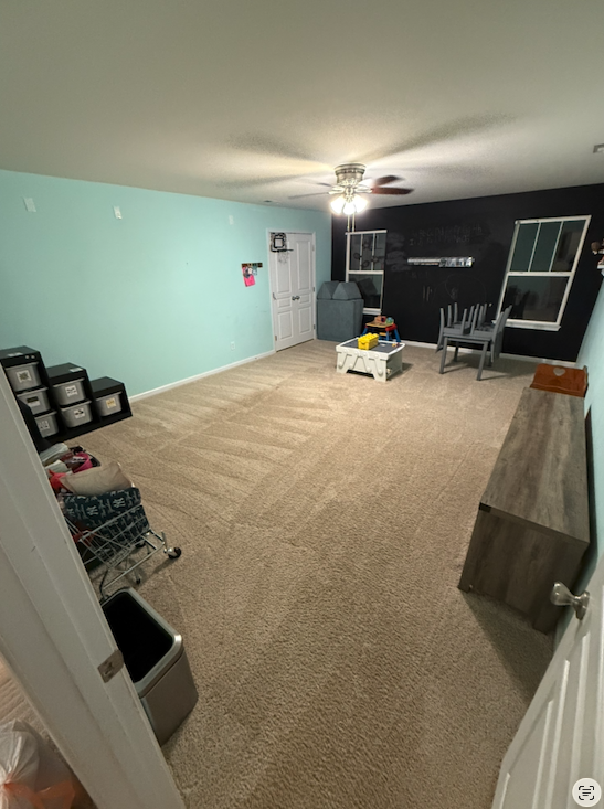 The same playroom, floor cleared and storage boxes stacked along the wall.